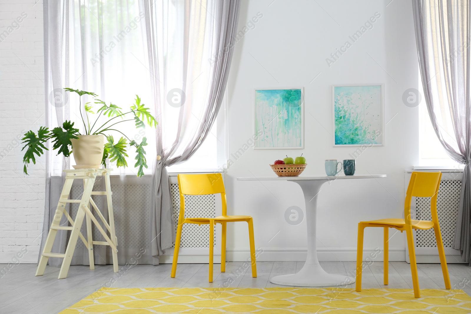 Photo of Room with comfortable table, chairs and stylish decor. Idea for interior design