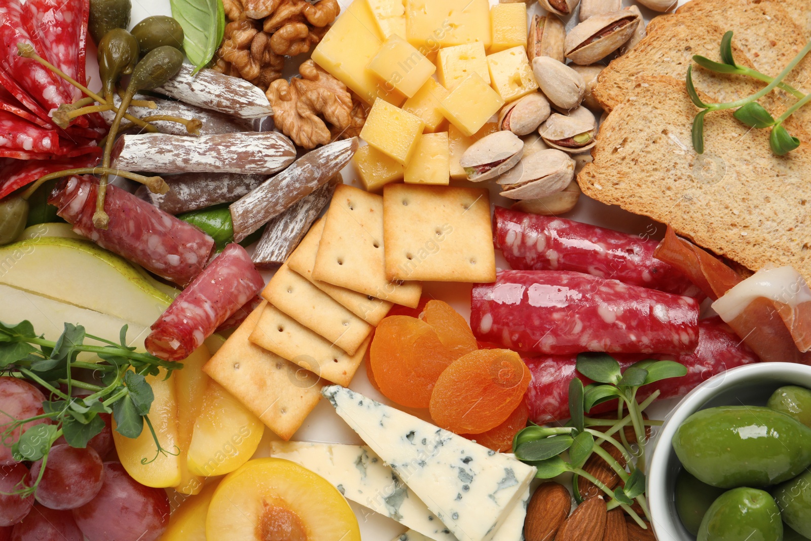 Photo of Different tasty appetizers as background, top view