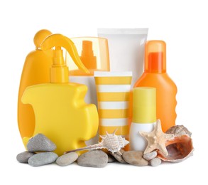 Different suntan products, seashells, starfish and stones on white background