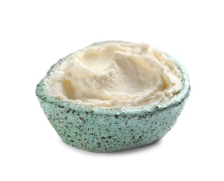 Photo of Bowl of tasty cream cheese on white background