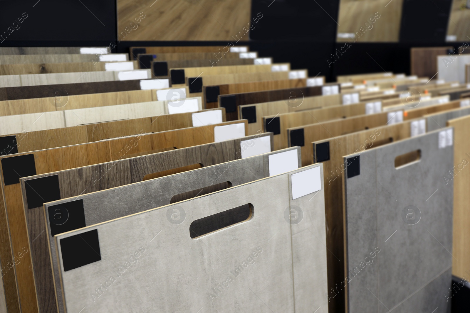 Photo of Many different samples of wooden flooring in store