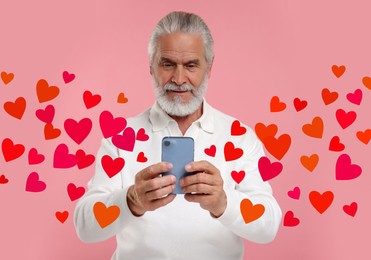 Long distance love. Man chatting with sweetheart via smartphone on pink background. Hearts flying out of device and swirling around him