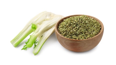 Photo of Fennel bulb and seeds in wooden bowl isolated on white