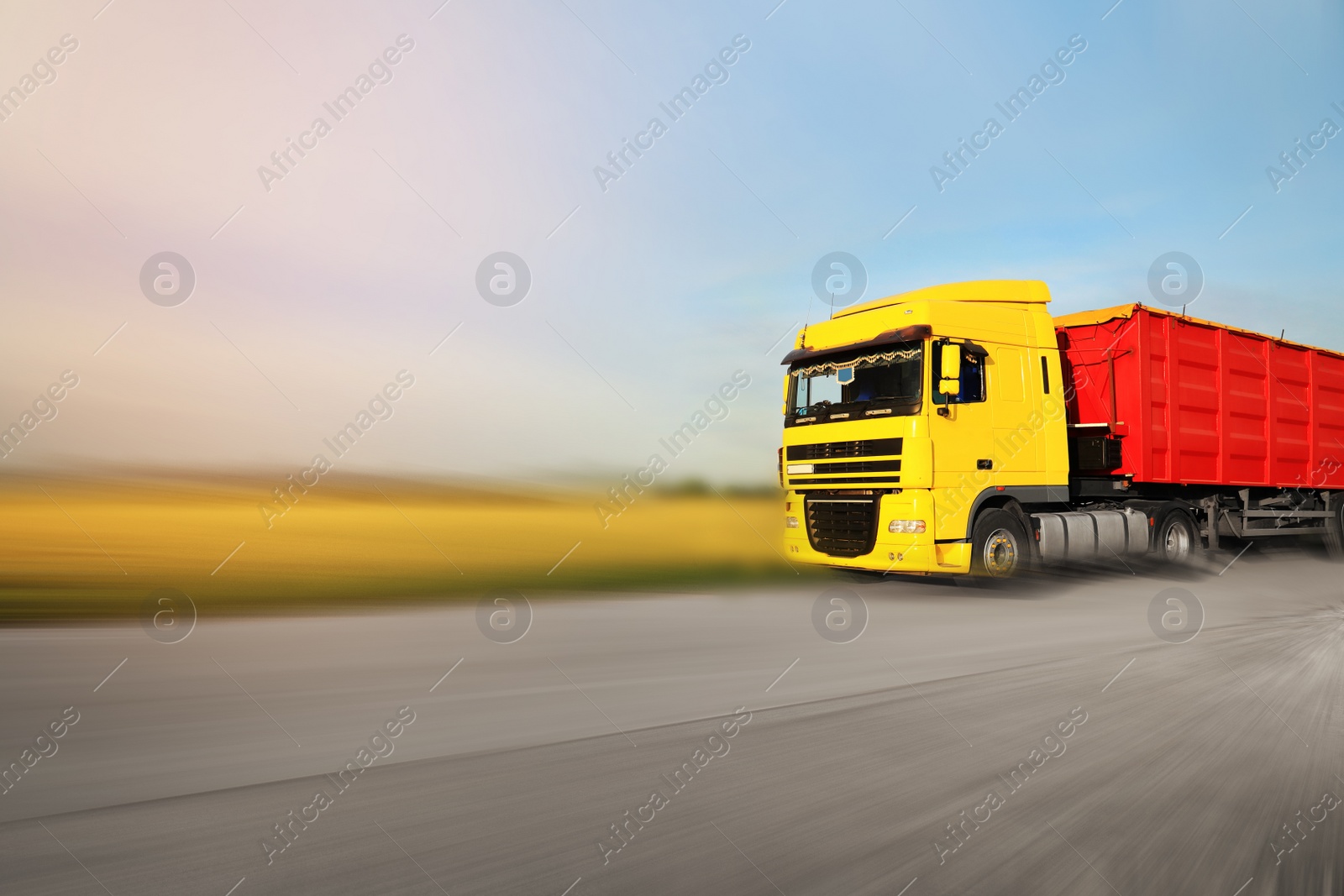 Image of Logistics concept. Truck on country road, motion blur effect 