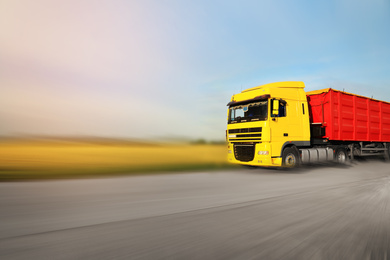 Image of Logistics concept. Truck on country road, motion blur effect 