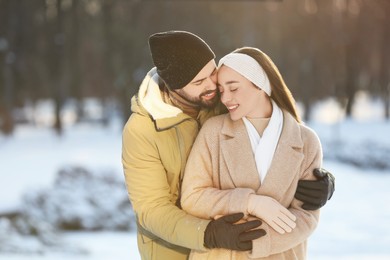 Photo of Beautiful young couple enjoying winter day outdoors