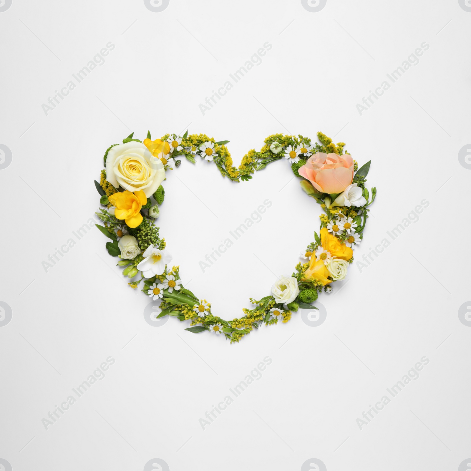 Photo of Beautiful heart made of different flowers on white background, top view