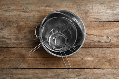 Photo of Cooking utensils on wooden table, top view