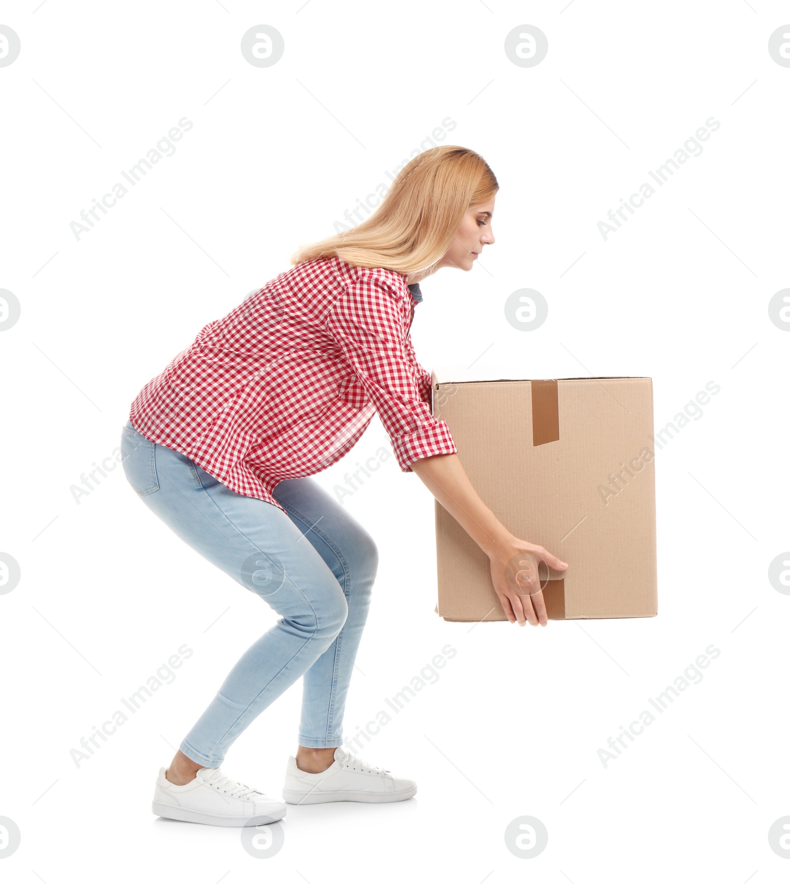 Photo of Full length portrait of woman lifting carton box on white background. Posture concept