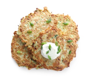 Delicious zucchini fritters with sour cream and onion on white background, top view