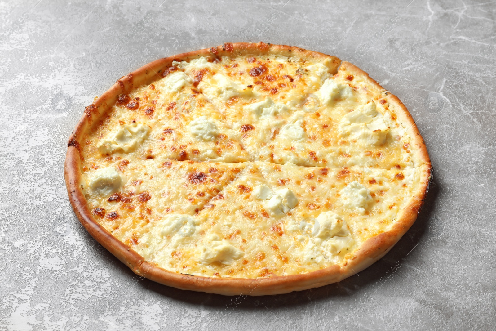 Photo of Delicious hot cheese pizza on grey background