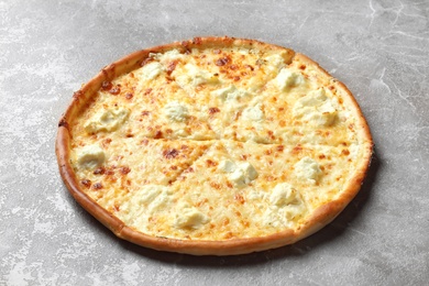 Delicious hot cheese pizza on grey background