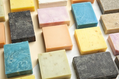 Hand made soap bars on color background