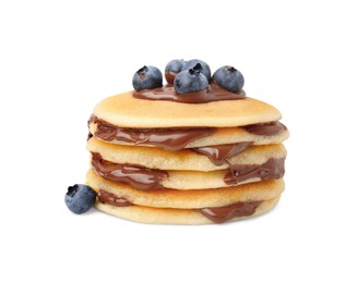 Photo of Stack of tasty pancakes with chocolate spread and blueberries isolated on white