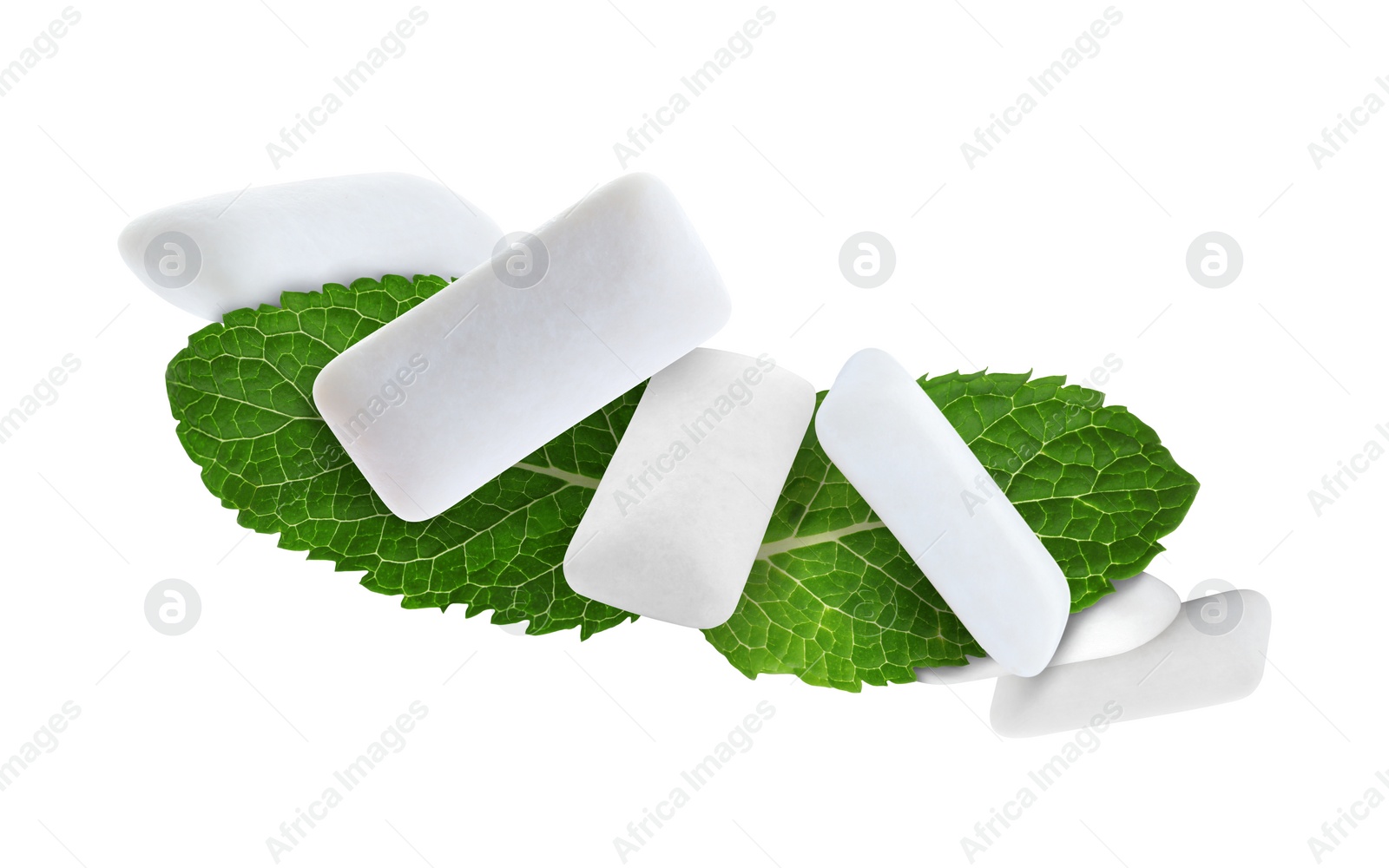 Image of Fresh mint leaves and chewing gum pads flying on white background