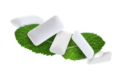 Image of Fresh mint leaves and chewing gum pads flying on white background