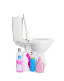 New ceramic toilet bowl and bottles of detergent on white background