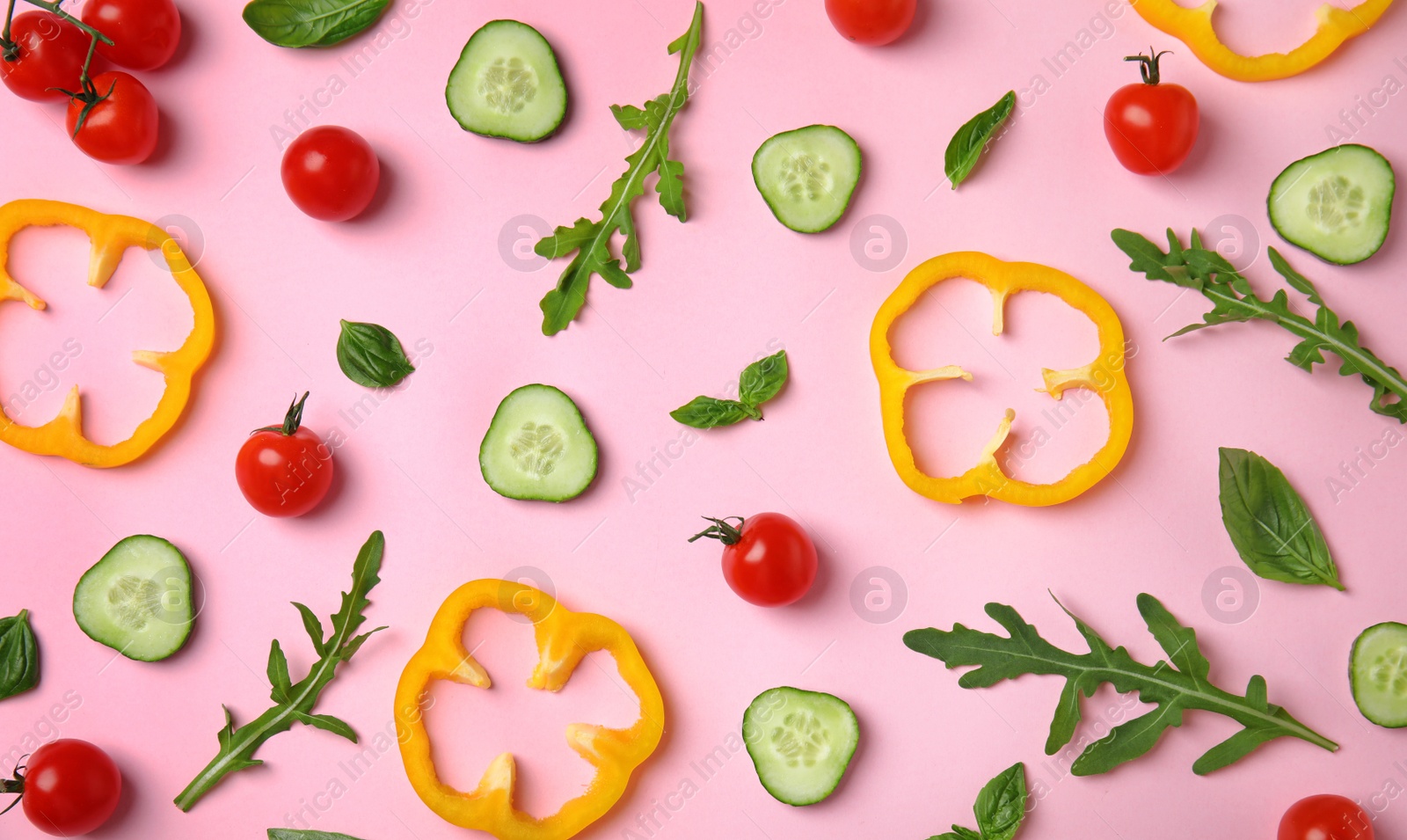 Photo of Flat lay composition with fresh ingredients for salad on pink background