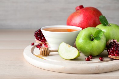 Photo of Honey, pomegranate and apples on wooden table. Rosh Hashana holiday
