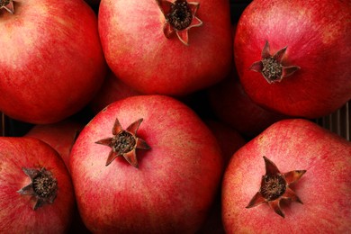 Fresh ripe pomegranates as background, top view