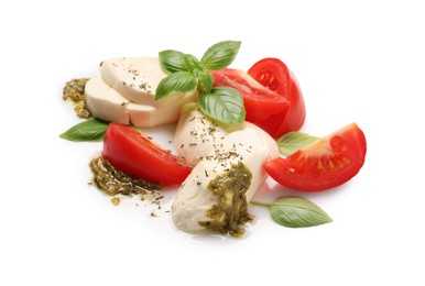 Photo of Tasty salad Caprese with mozzarella, tomatoes, basil and pesto sauce isolated on white