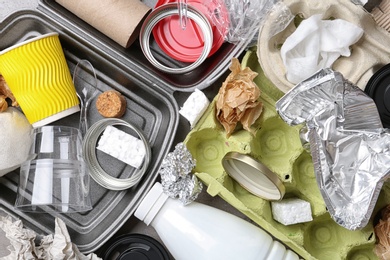 Pile of different garbage as background, top view. Recycling problem