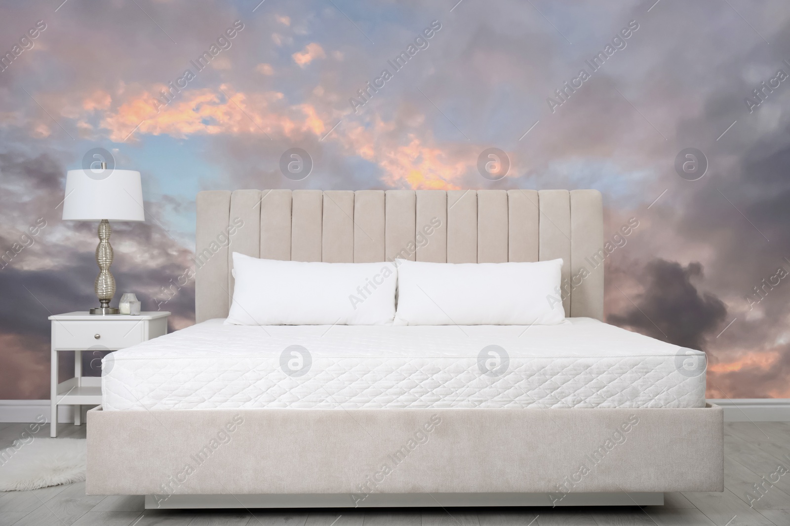 Image of Pattern of sunset sky with clouds on wallpaper indoors. Beautiful bedroom interior