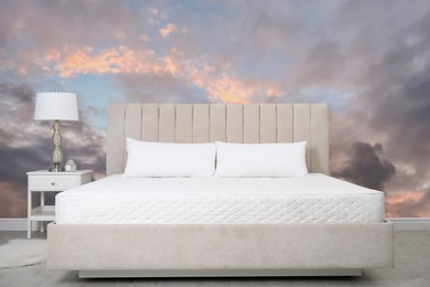 Image of Pattern of sunset sky with clouds on wallpaper indoors. Beautiful bedroom interior