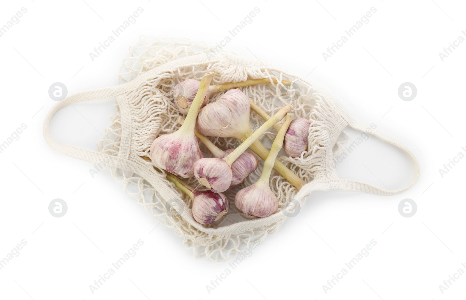 Photo of String bag with garlic isolated on white, top view