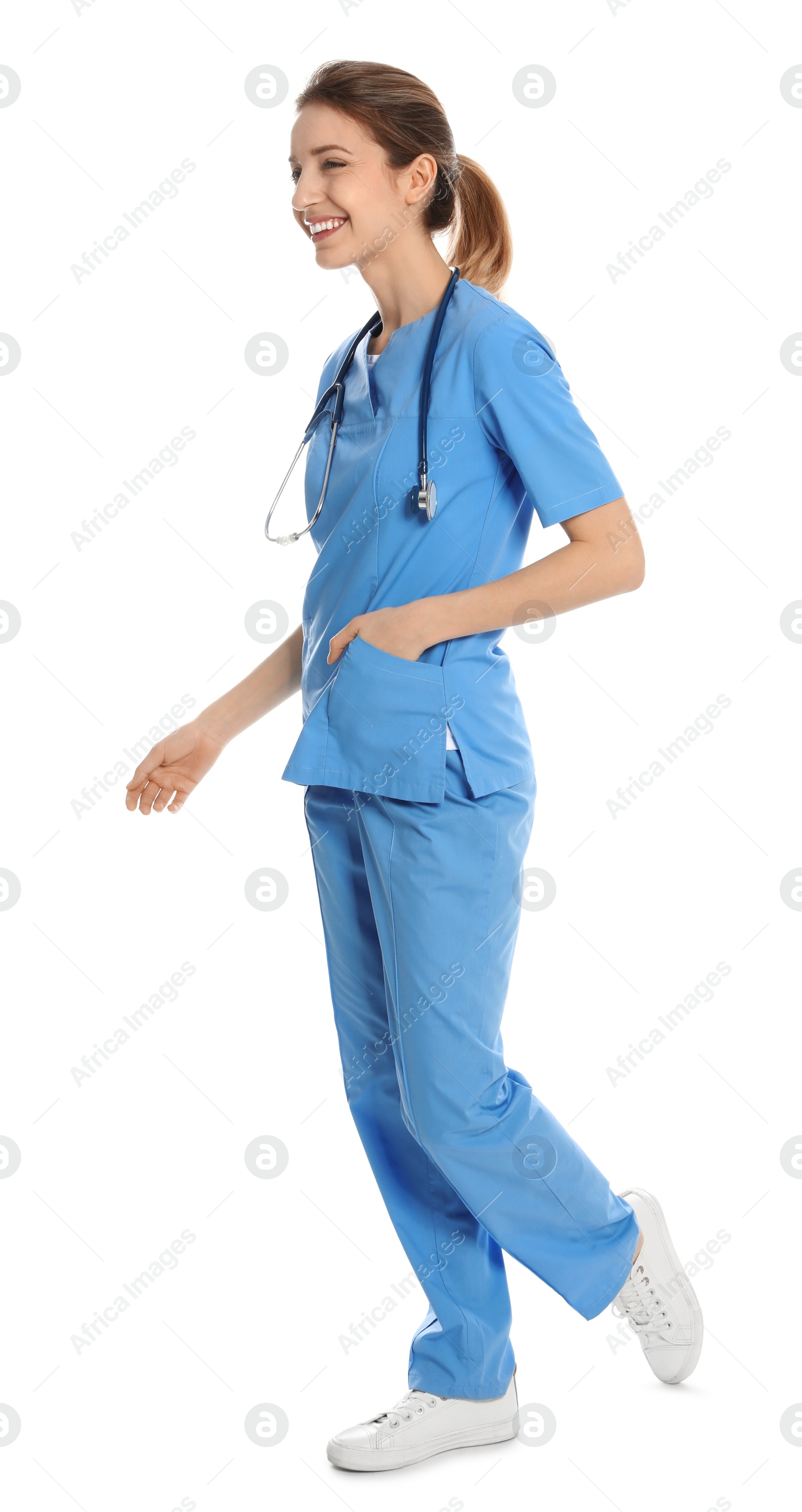 Photo of Full length portrait of medical doctor with stethoscope isolated on white