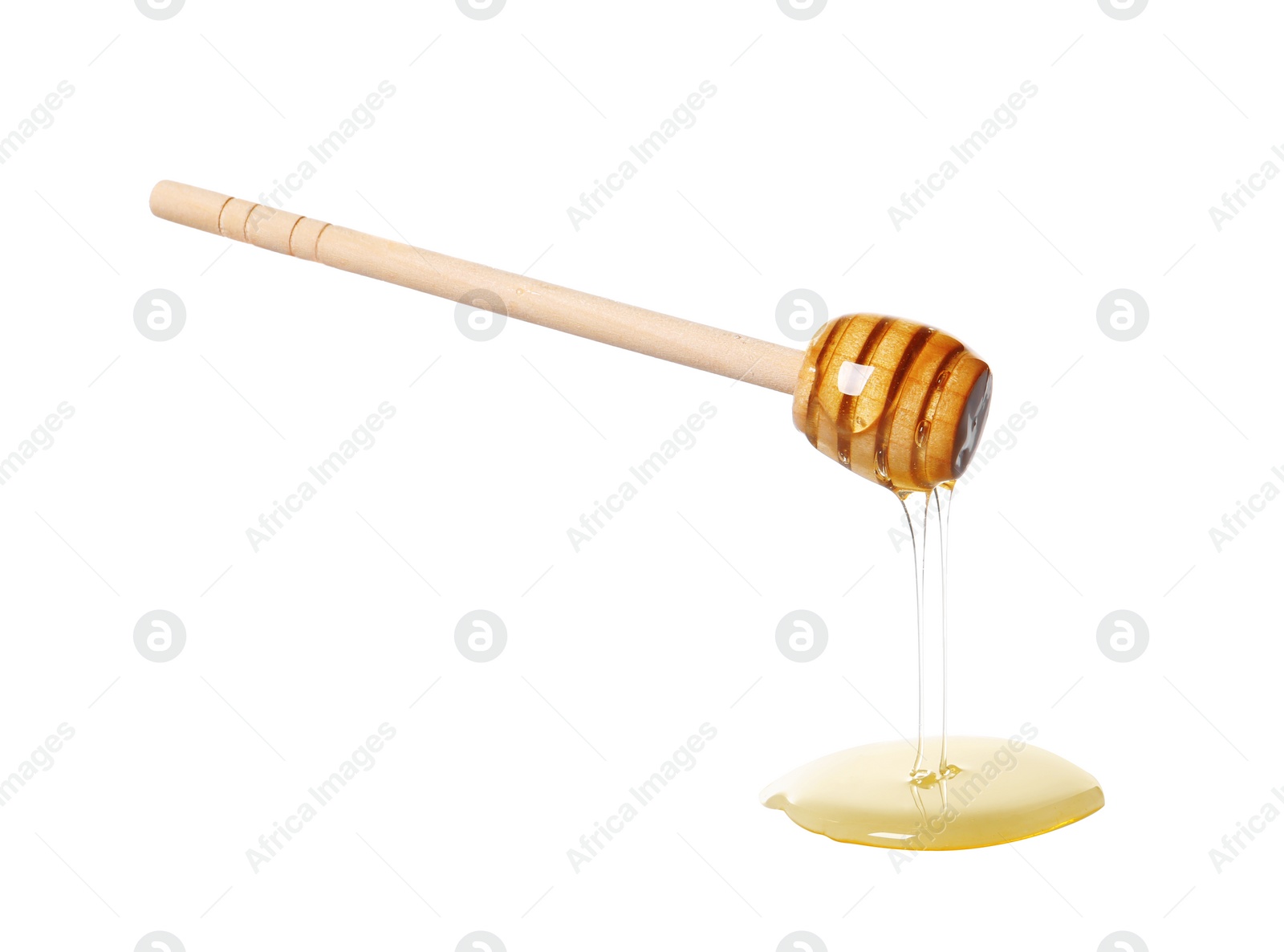 Photo of Natural honey dripping from dipper on white background