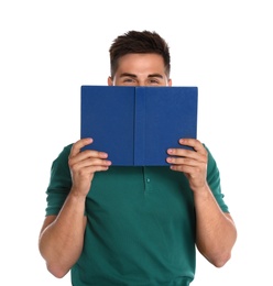 Handsome young man reading book on white background