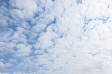 Beautiful fluffy white clouds in blue sky