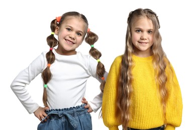 Image of Portrait of cute twin sisters on white background