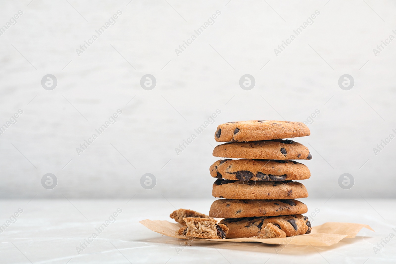 Photo of Stack of tasty chocolate cookies on light table