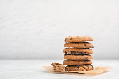 Photo of Stack of tasty chocolate cookies on light table