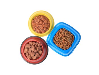 Photo of Dry and wet pet food in feeding bowls isolated on white, top view