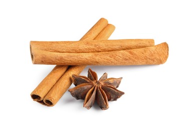 Photo of Cinnamon sticks and anise star isolated on white