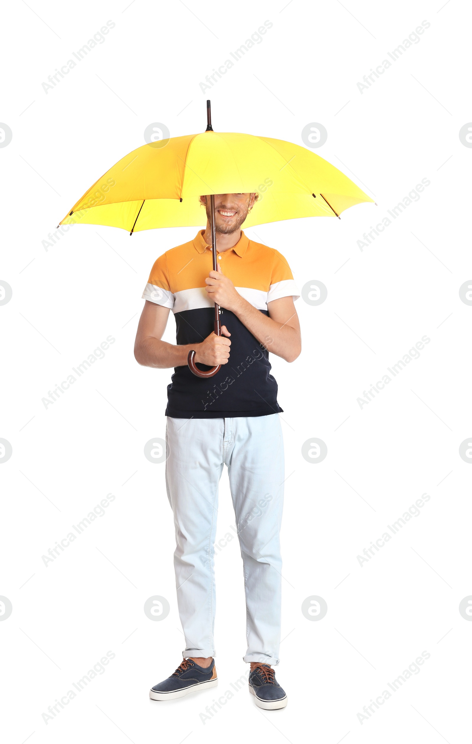 Photo of Man with yellow umbrella on white background