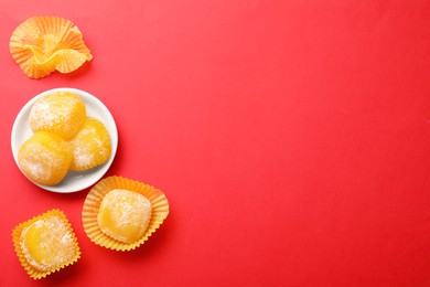 Delicious mochi on red background, flat lay with space for text. Traditional Japanese dessert