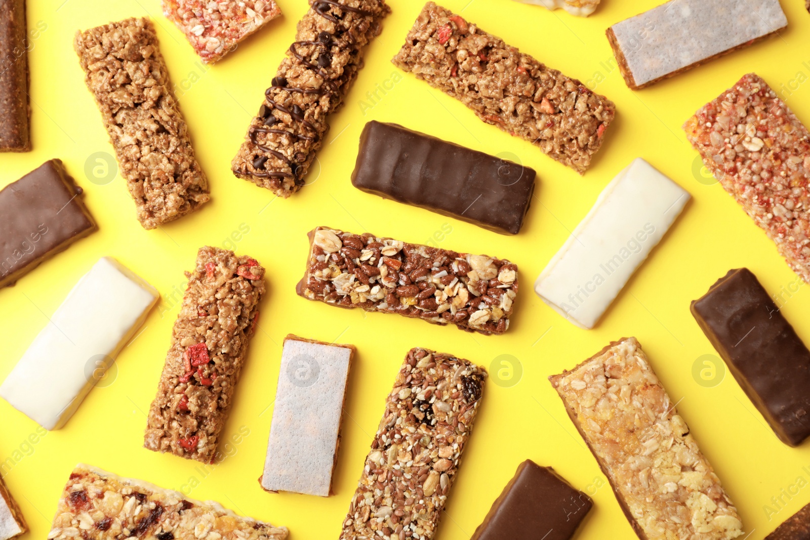 Photo of Flat lay composition with protein bars on color background