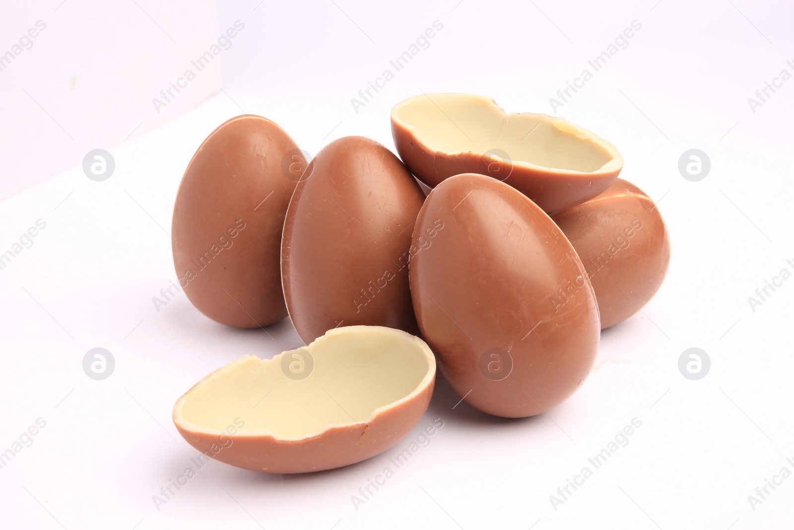 Photo of Sveti Vlas, Bulgaria - June 27, 2023: Unwrapped Kinder Surprise Eggs isolated on white