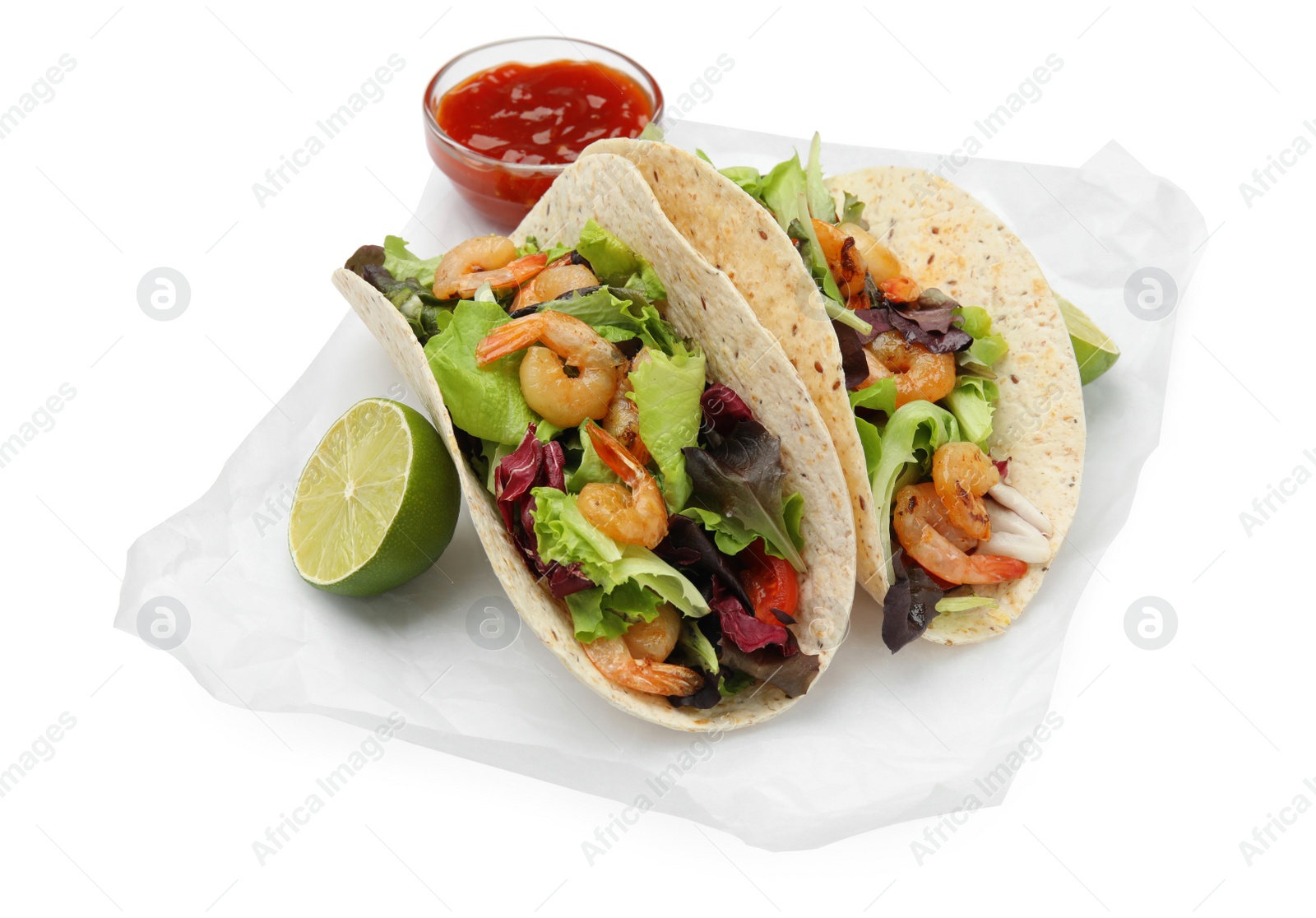 Photo of Delicious tacos with shrimps, lime and sauce on white background
