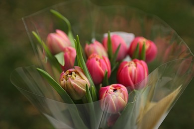 Photo of Beautiful bouquet of tulip flowers outdoors, closeup