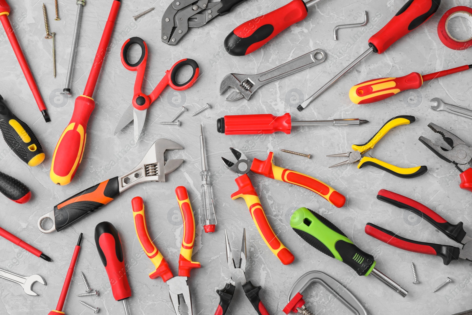 Photo of Flat lay composition with different construction tools on marble background