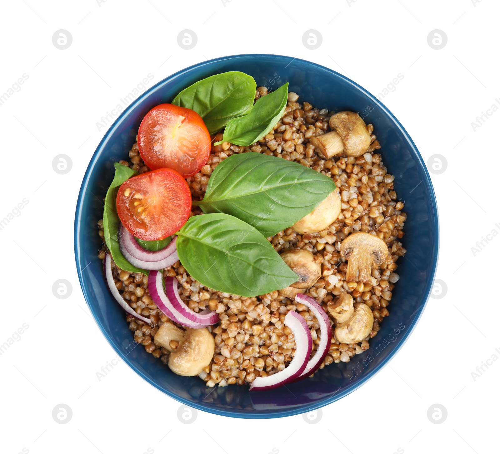 Photo of Bowl of buckwheat porridge with vegetables an mushrooms on white background, top view