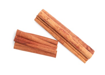 Dry aromatic cinnamon sticks isolated on white, top view