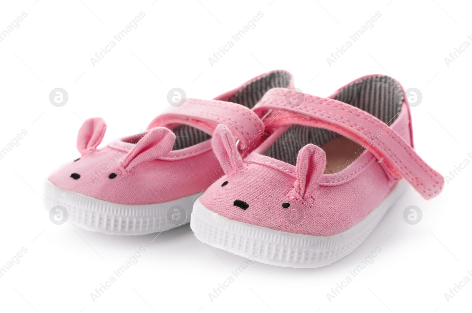 Photo of Cute pink child shoes isolated on white