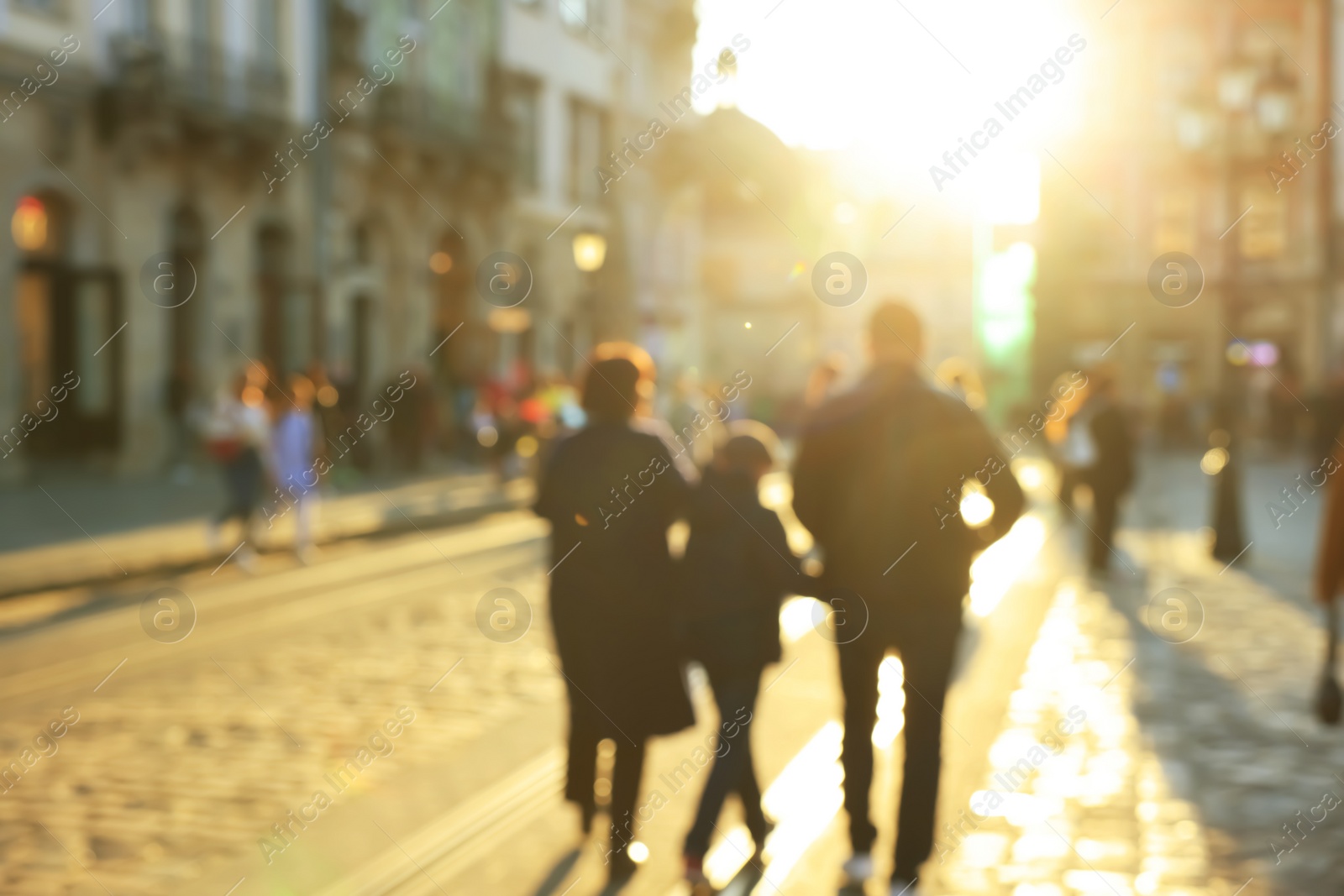 Photo of Blurred view of people walking on city street