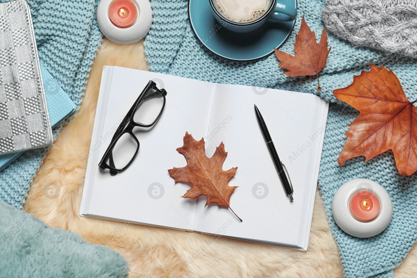 Photo of Flat lay composition with book, cup of coffee and warm blanket on fuzzy rug